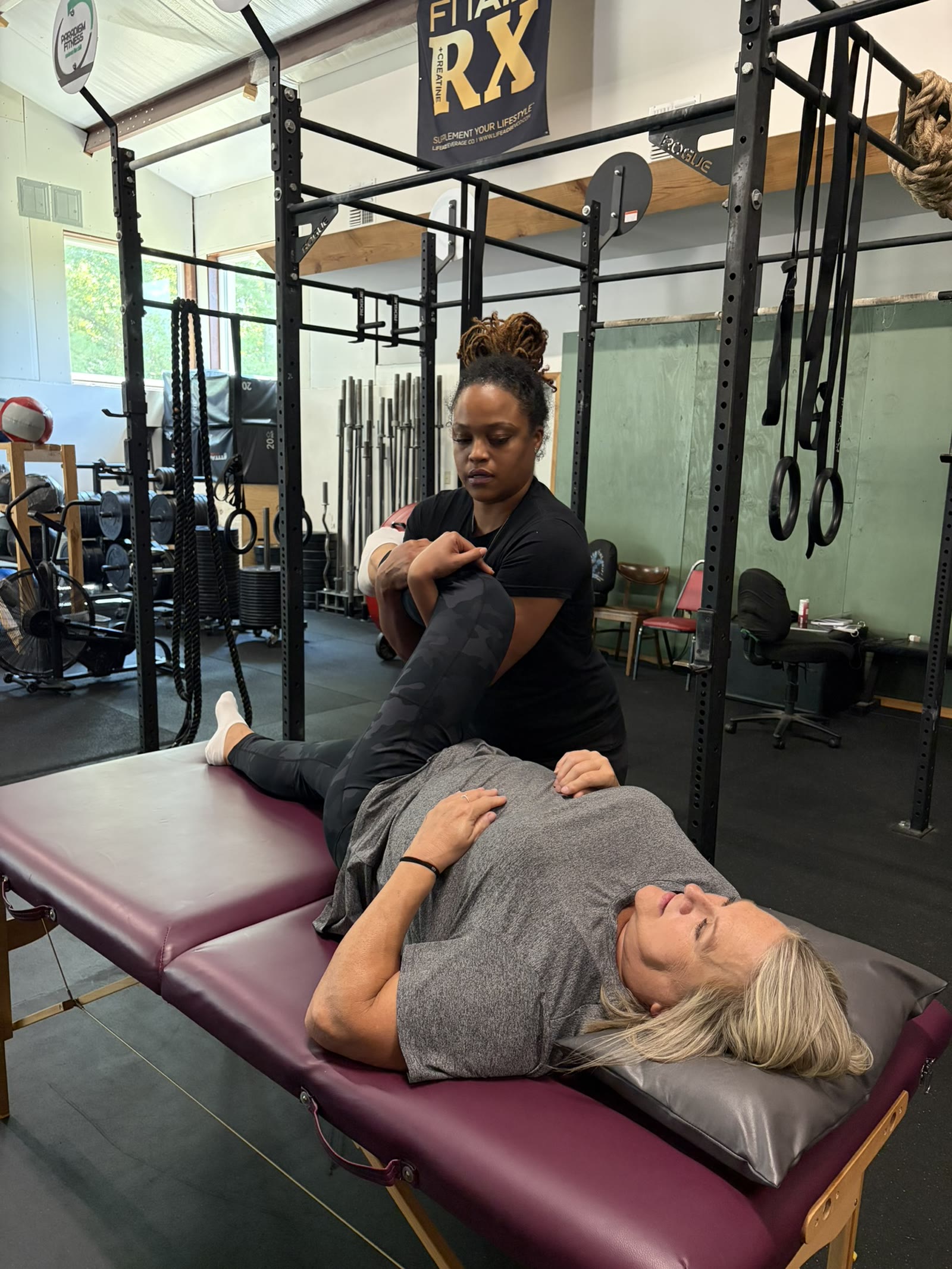 A client receiving a supported leg stretch