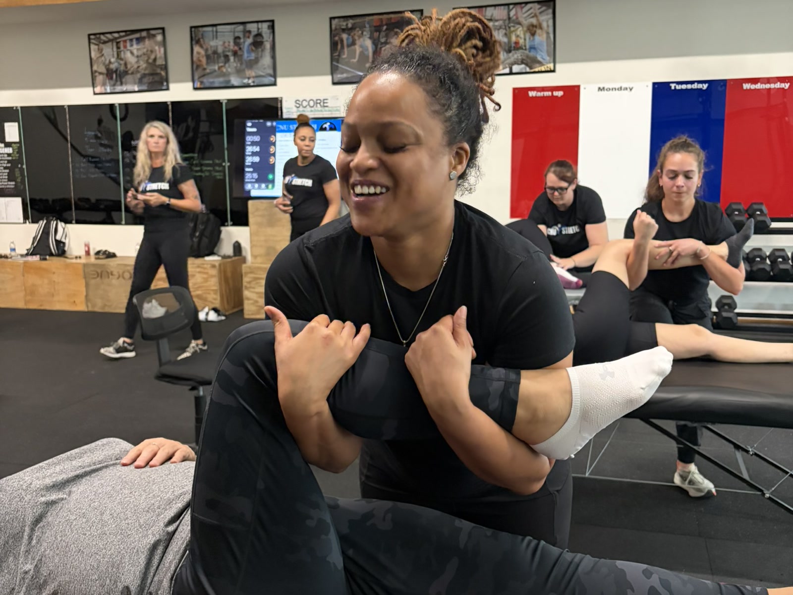 A group stretch session in the gym